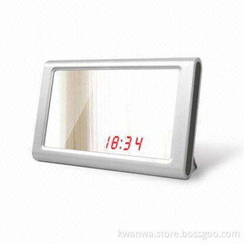 Novelty clock with mirror, sound and touch sensor, daily alarm and snooze time can be set